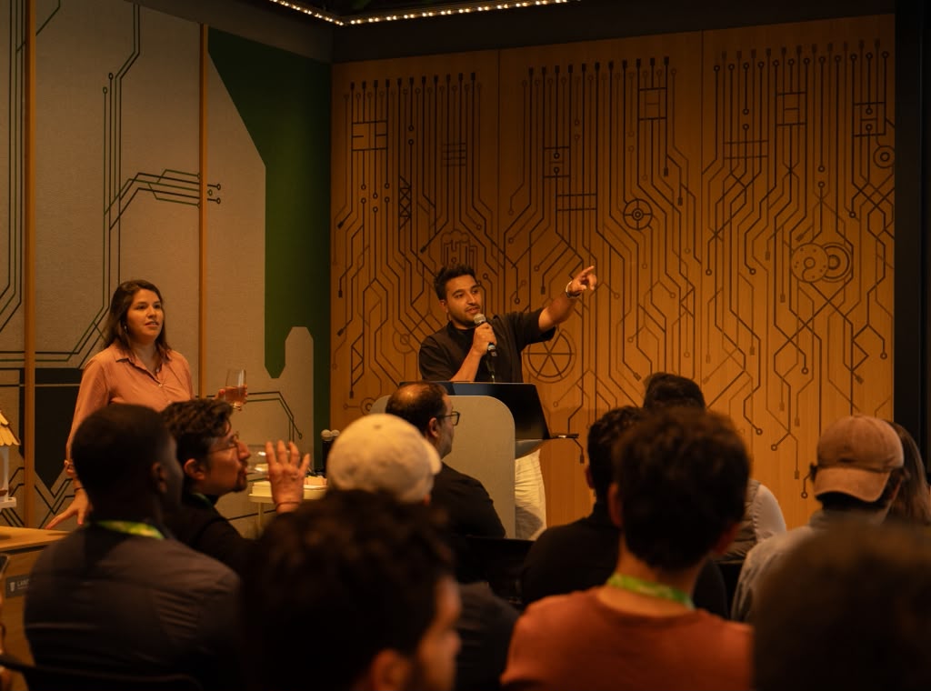 Full room listening to a founder talk