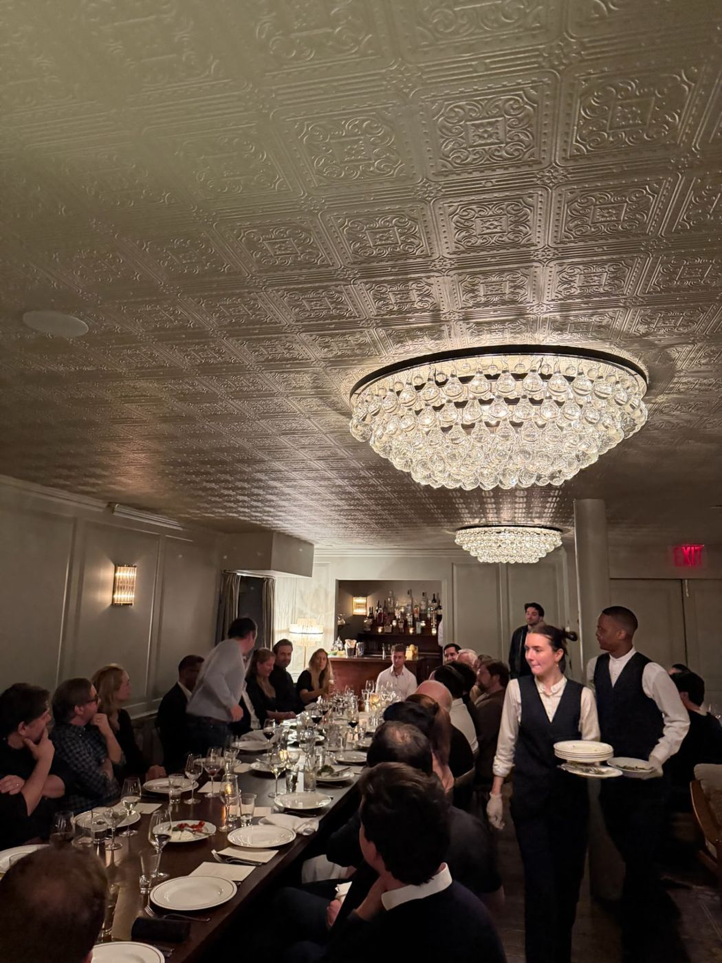 Colectivo members at a long dinner table in New York
