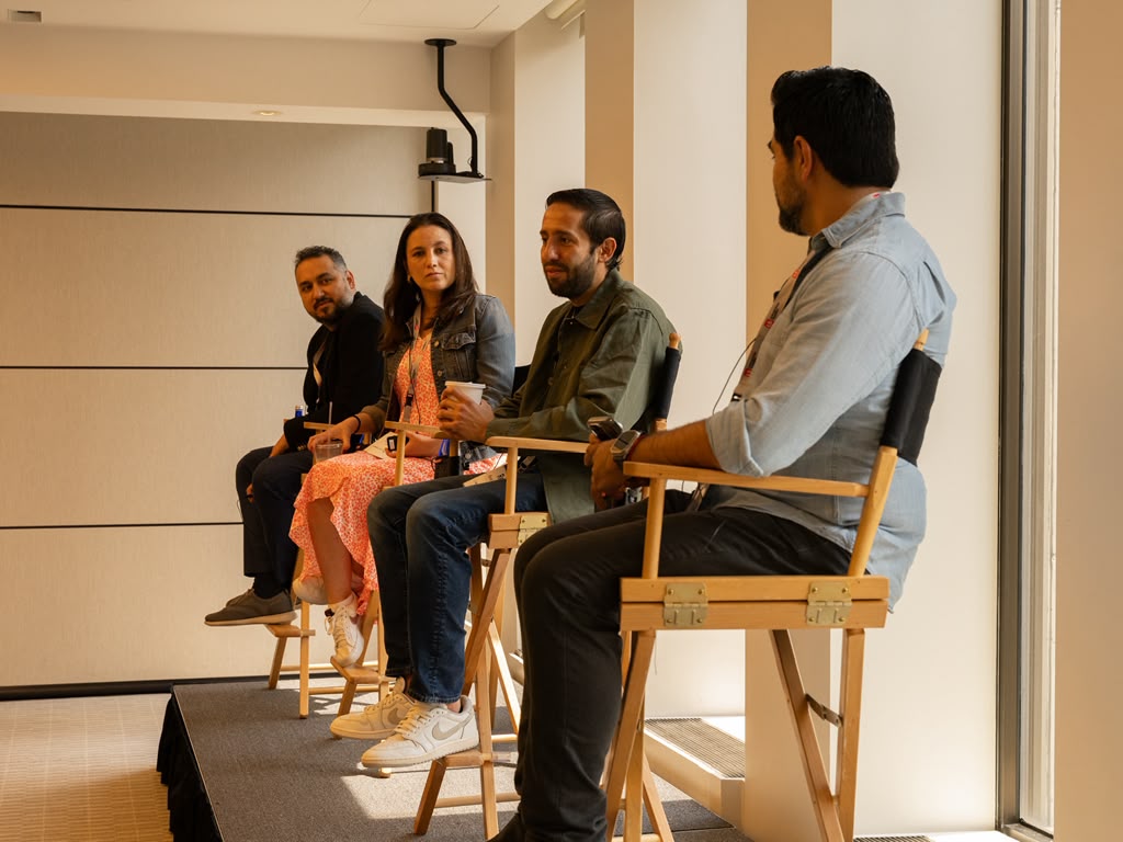 Panel of founders and investors on stage